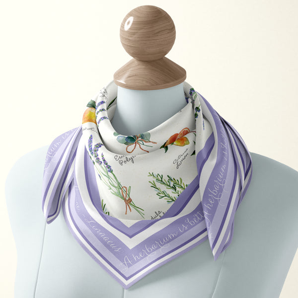 Aromatherapy silk scarf with botanical illustration and Latin plant nomenclature names of aromatic plants and herbs by Darya Karenski. Purple border with script of Carl Linnaeus quote