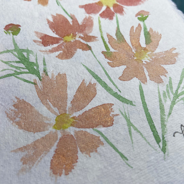 Closeup of cosmos botanical illustration by Darya Karenski with gold metallic watercolor