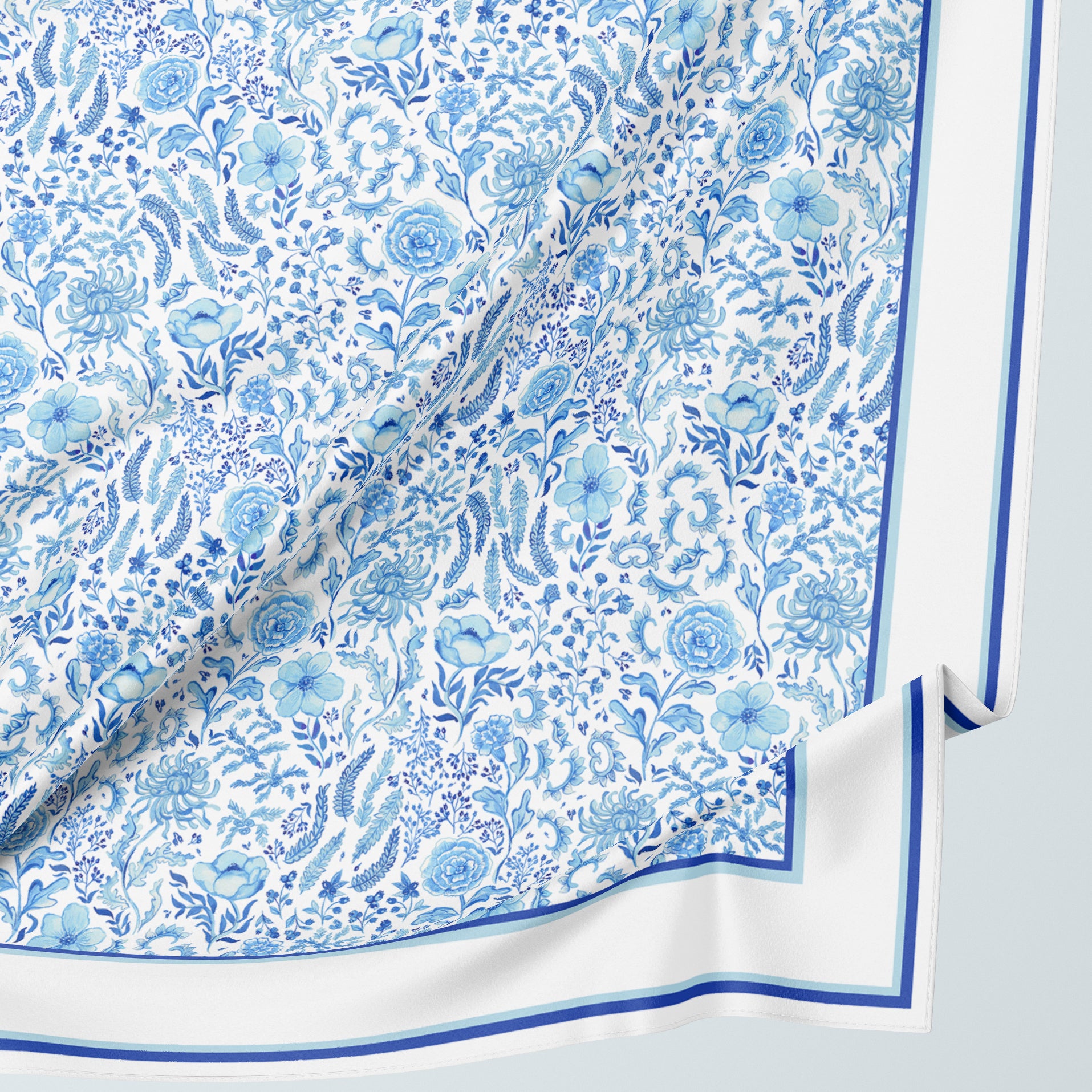 Sophisticated silk scarf gift with a porcelain blue floral pattern by Darya Karenski