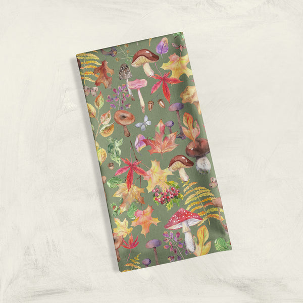 Colorful fall mushrooms on olive green cotton linen dish towel by Darya Karenski