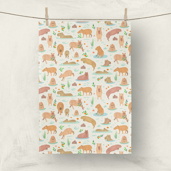 Swimming and jumping capybaras linen dish towel made in the US.