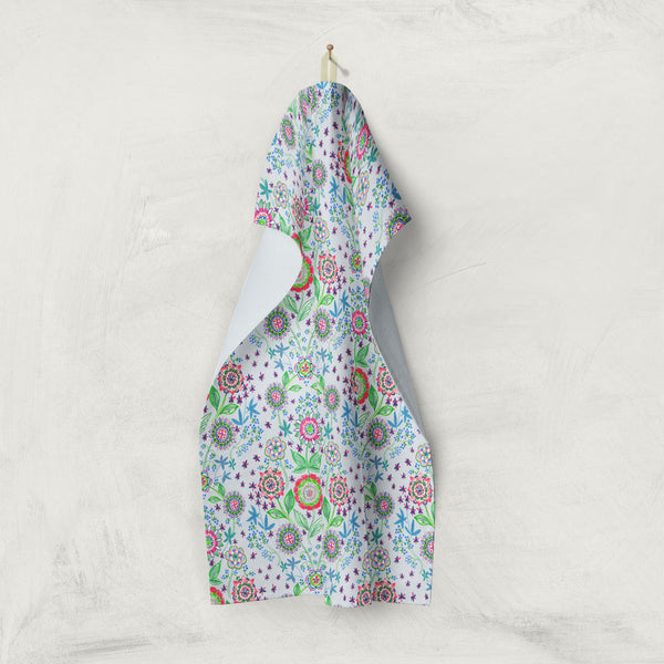 Light blue kitchen towel with flower medallions and leaves by artist Darya Karenski from Boston