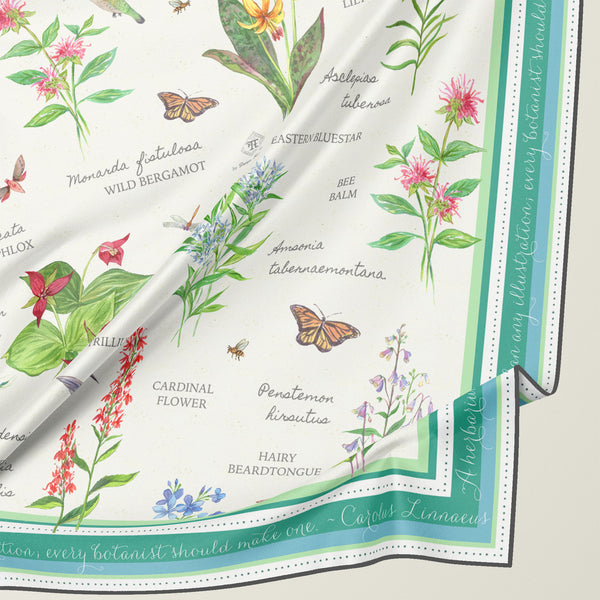 Square silk scarf with botanical illustration and binomial nomenclature names of New England native plants by artist Darya Karenski.