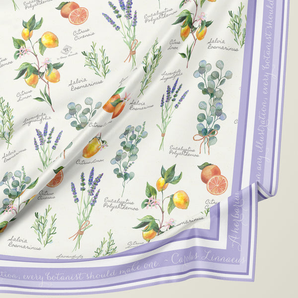 Aromatherapy silk scarf with botanical illustration and Latin plant nomenclature names of aromatic plants and herbs by Darya Karenski. Purple border with script of Carl Linnaeus quote