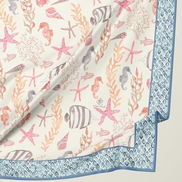 Coastal silk scarf by Darya Karenski with starfish, seahorse, fish, seaweed and watercolor geometric border